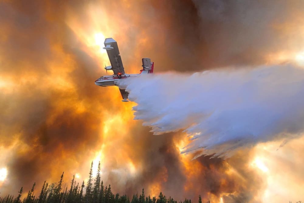 Plane extinguishing massive wildfire