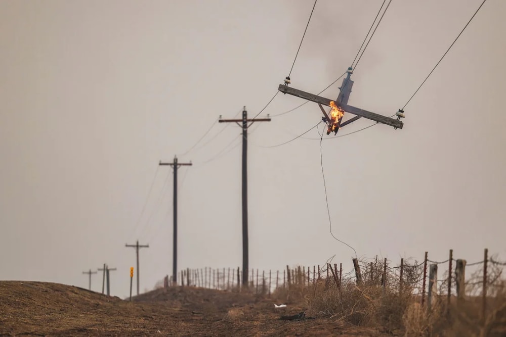 A telephone pole burns from the Smokehouse Creek Fire on February 28 in Canadian, Texas.