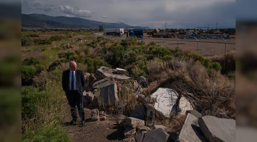 Rob Dotson, the city manager of Enoch, visits what was to be the new Parkview subdivision, where work is now abandoned due to ground fissuring from subsidence, on June 12, 2023.