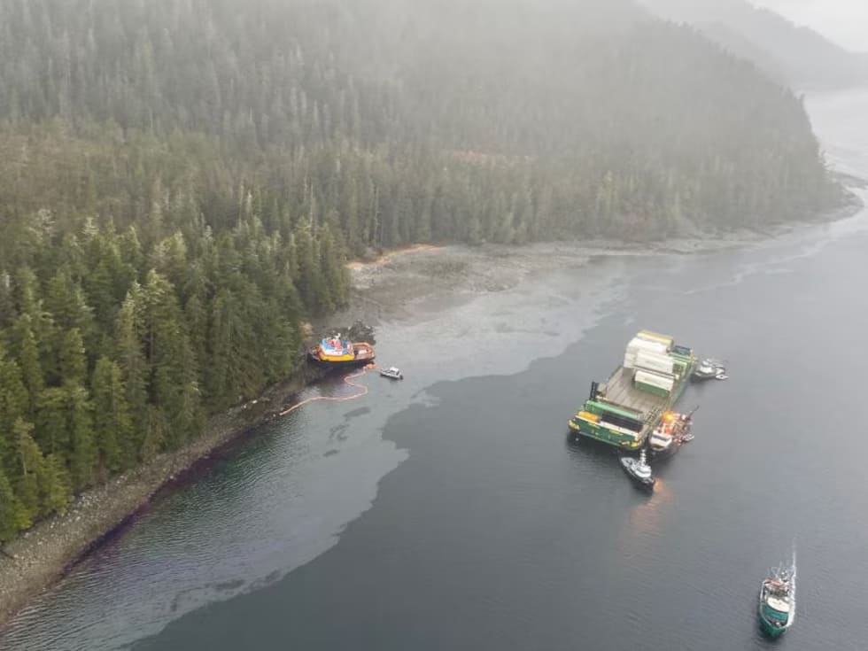 A tug boat collided with a freight barge it was towing