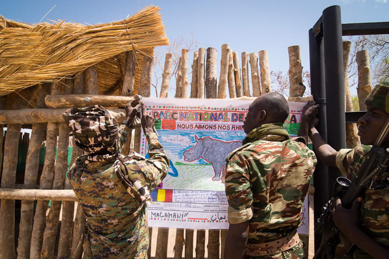Rangers in Zakouma with a sign from local schoolchildren
