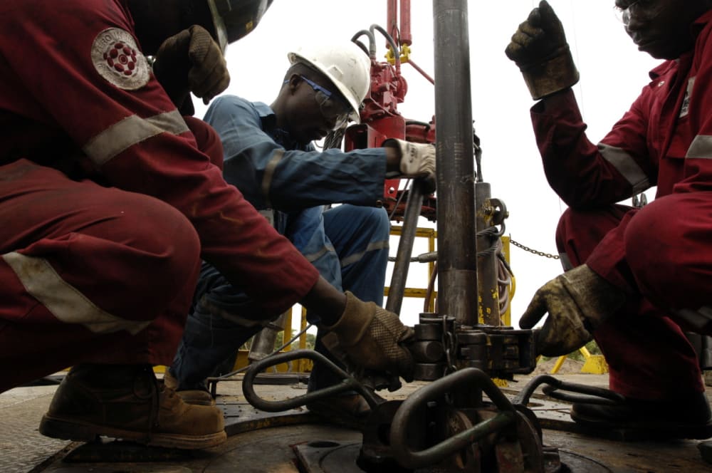 Workers at the Komé oilfield near Doba