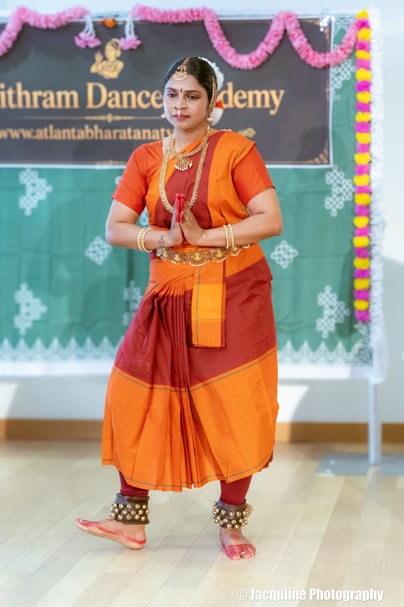 Indian classical dancer in traditional Bharatanatyam costume at dance academy