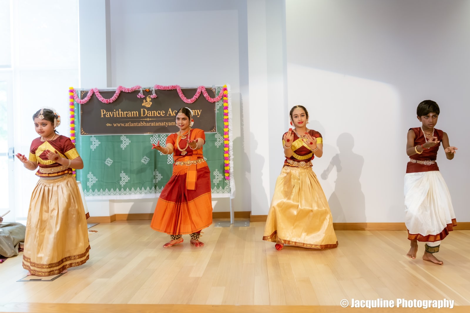 Young dancers performing classical Indian dance at Pavithram Dance Academy