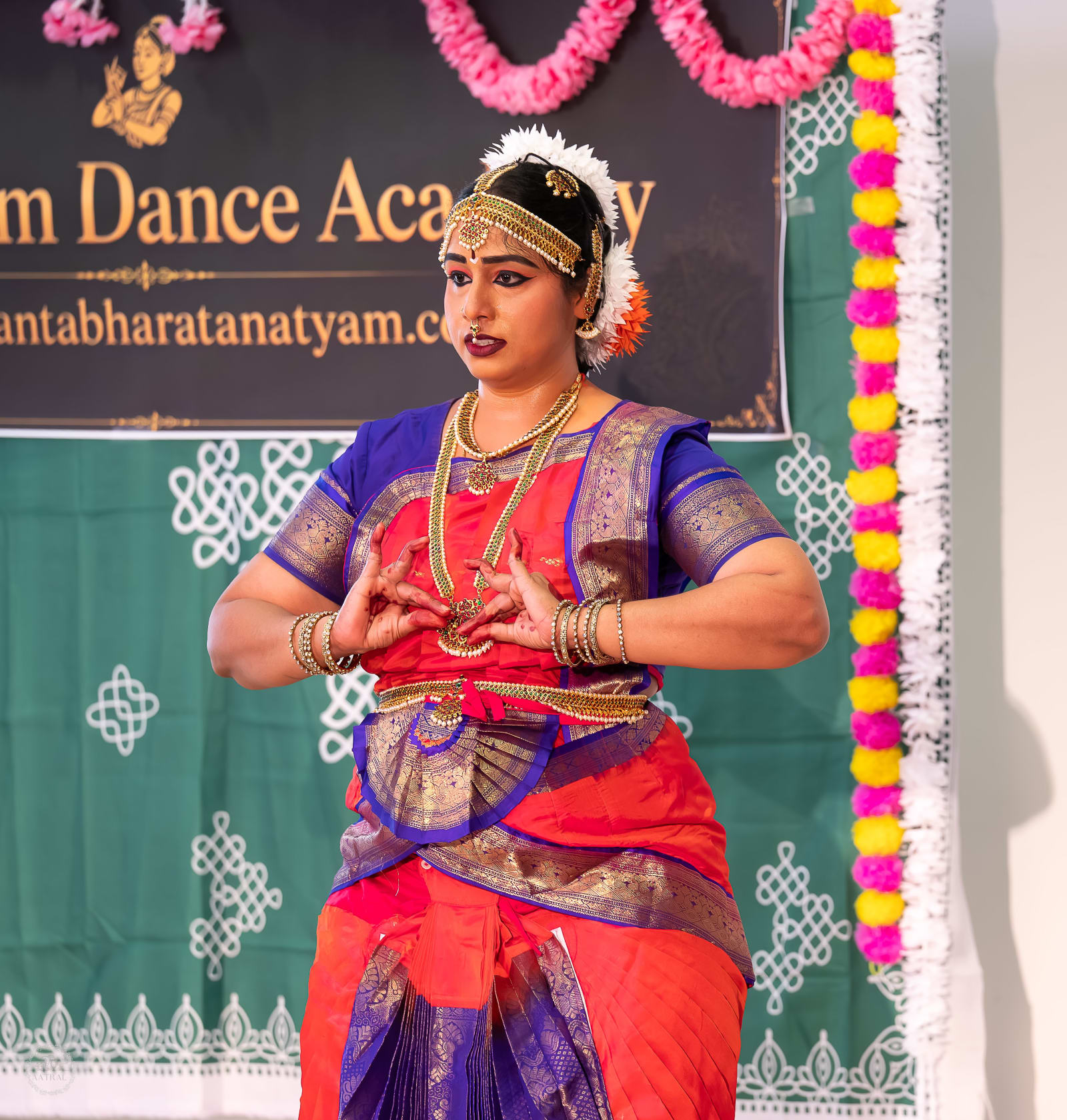Classical Indian dancer in traditional costume performing at dance academy