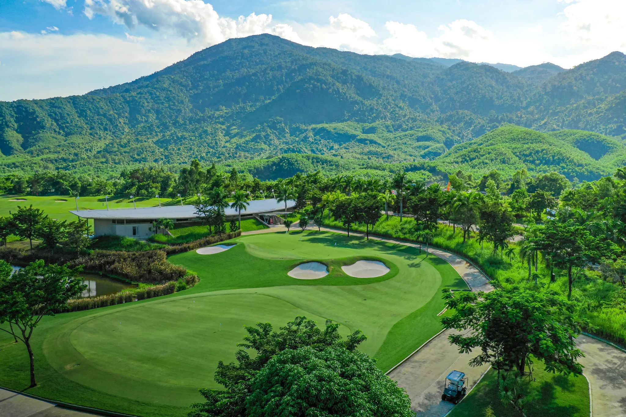 Ba Na Hills Golf Club — elevated tee box overlooking jungle valley and distant coastline