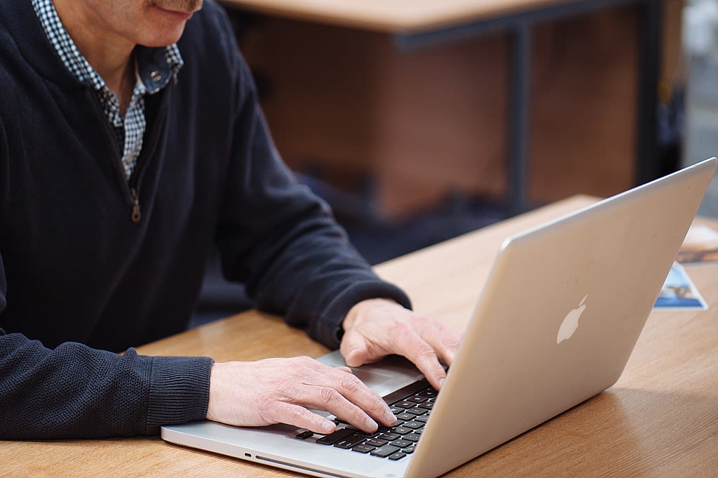 Clive Walker working with laptop