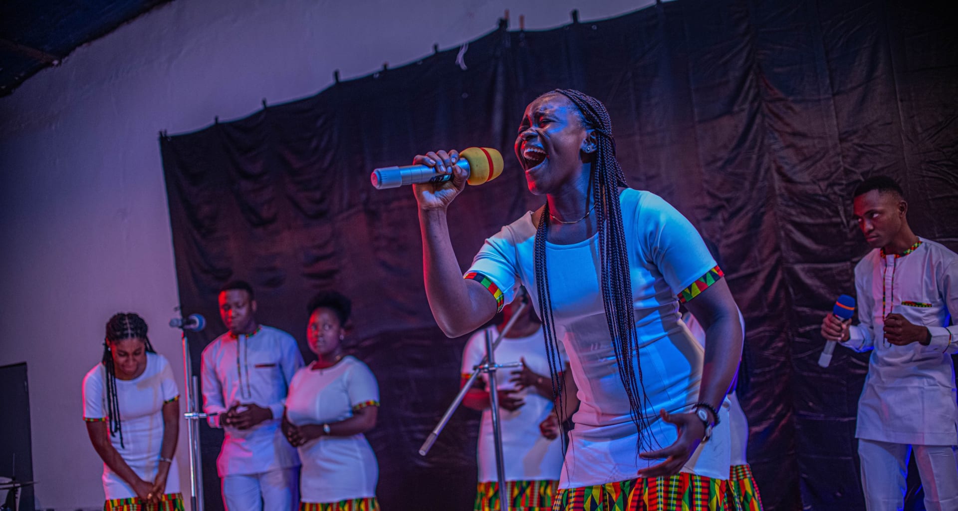 A G2 Melody soloist singing on stage