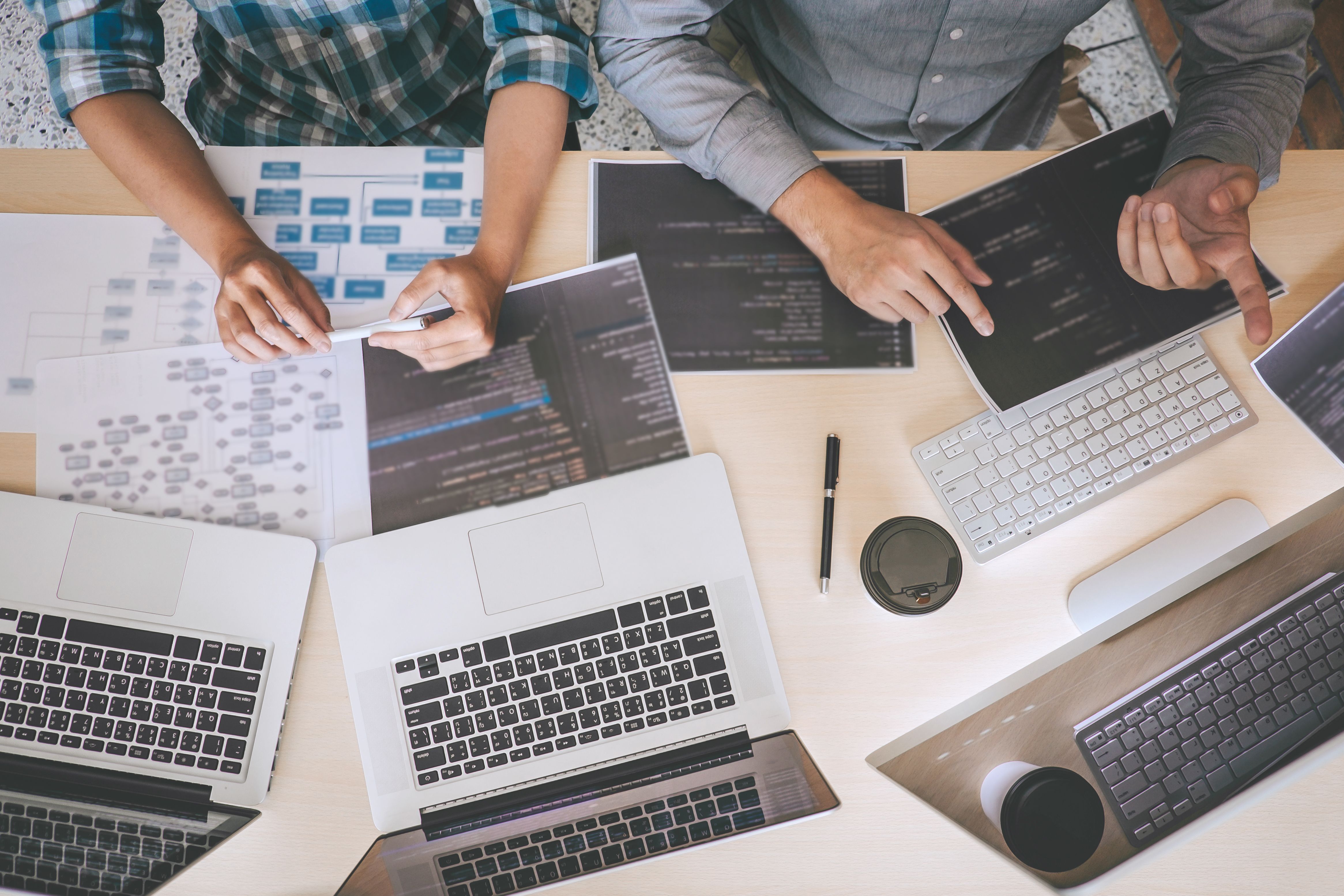 directly-shot-software-engineers-working-table.jpg