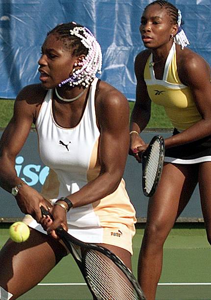 Serena Williams at Indian Wells / Evert Cup 1999 Doubles Round 1 — orange and white Puma outfit