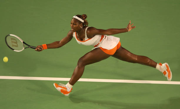 Serena Williams at Australian Open 2003 Final — white and orange Puma outfit