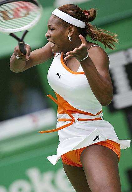 Serena Williams at Australian Open 2003 Round 2 — white and orange Puma outfit