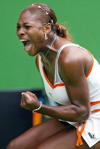 Serena Williams at Australian Open 2003 Round 1 — white, orange, and black Puma outfit