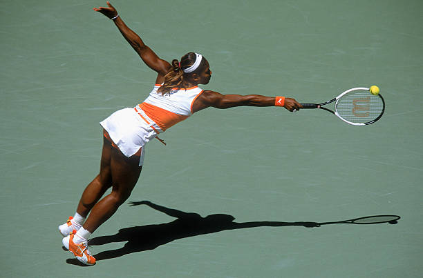 Serena Williams at Australian Open 2003 Quarter-Final — white and orange Puma outfit
