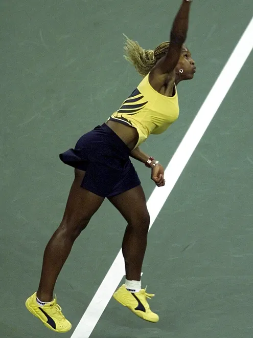 Serena Williams at US Open 2001 Round 1 — black and yellow Puma outfit