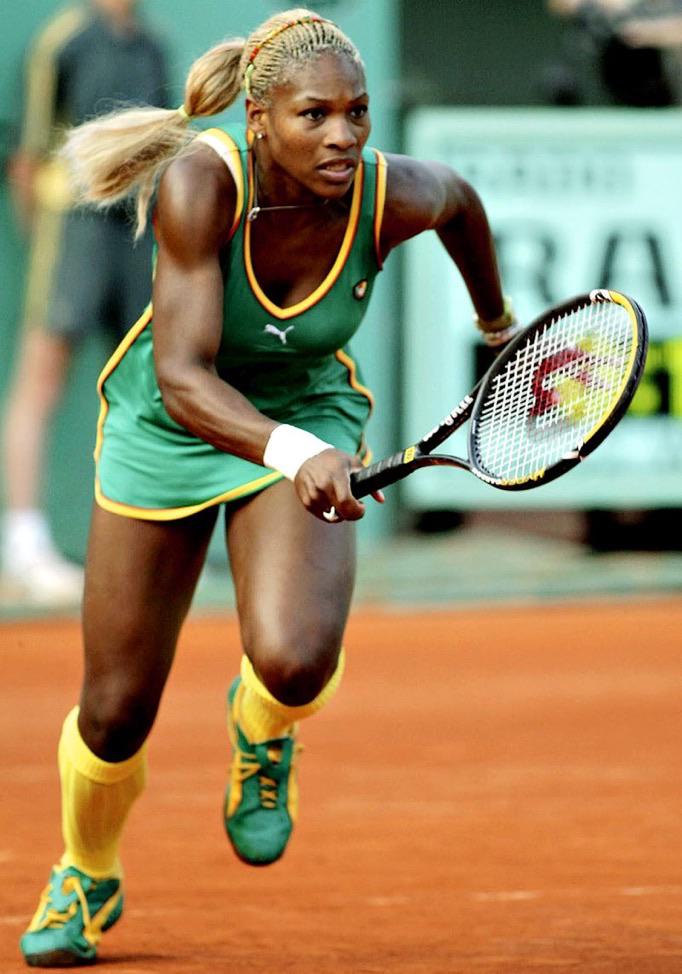 Serena Williams at Roland Garros 2002 Round 2 — gold, green, and red Puma outfit
