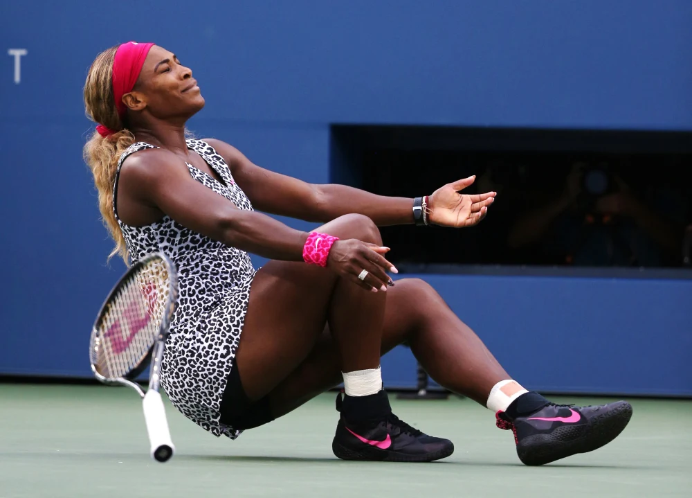 Serena Williams at US Open 2014 Final — white, black, and pink Nike outfit