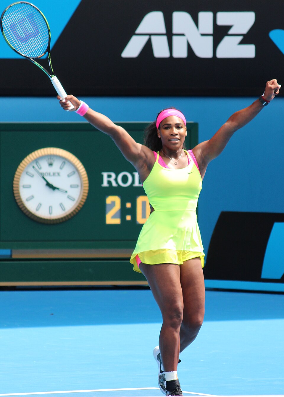 Serena Williams at Australian Open 2015 Round 1 — pink and green Nike outfit