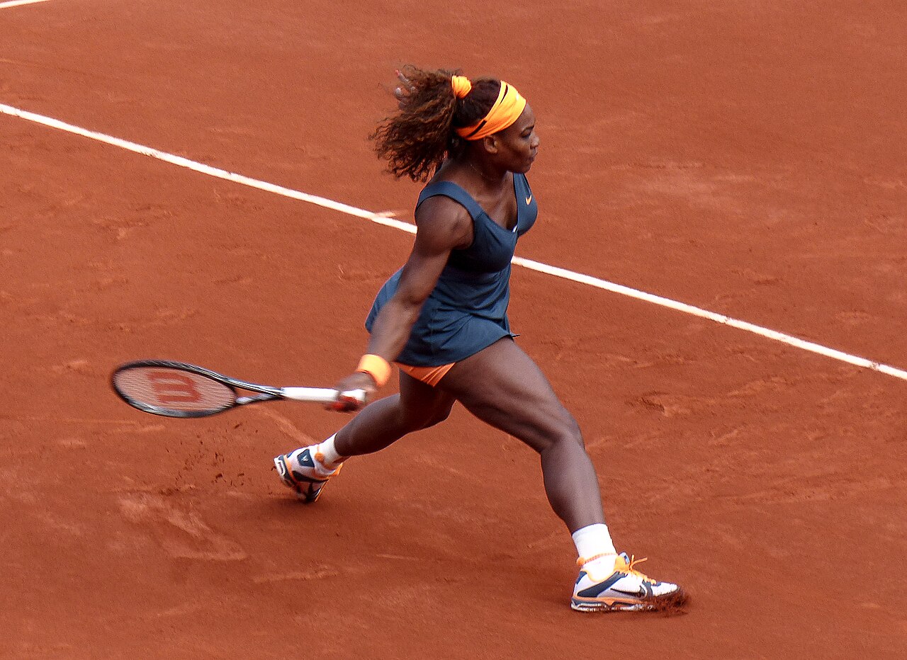 Serena Williams at Roland Garros 2013 Quarter-Final — orange and blue Nike outfit