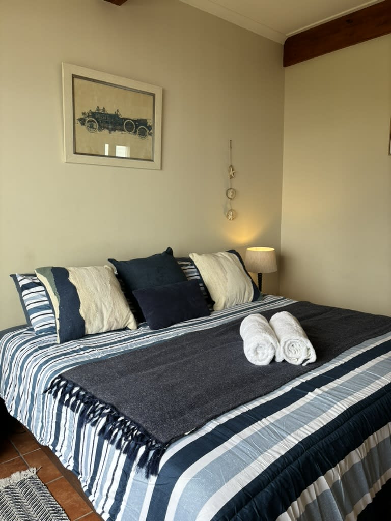 Indigenous garden and ocean view through The Garden Room window, Tsitsikamma