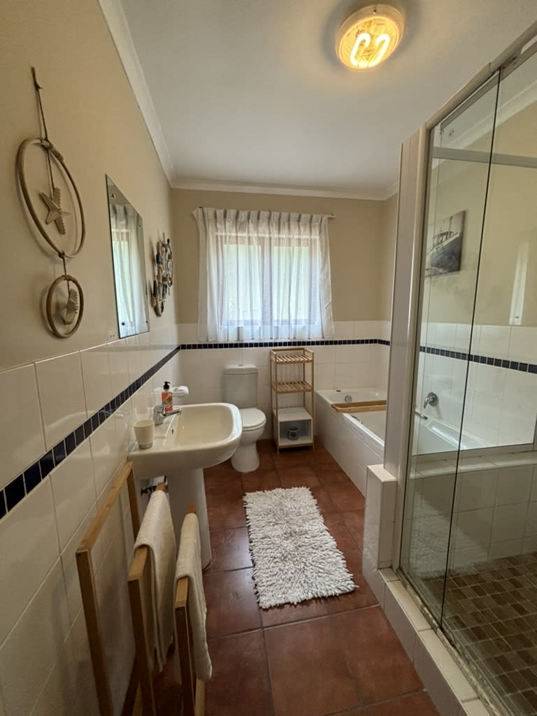 Spacious freestanding bathtub in The Sunrise Room ensuite, On The Rocks Villa