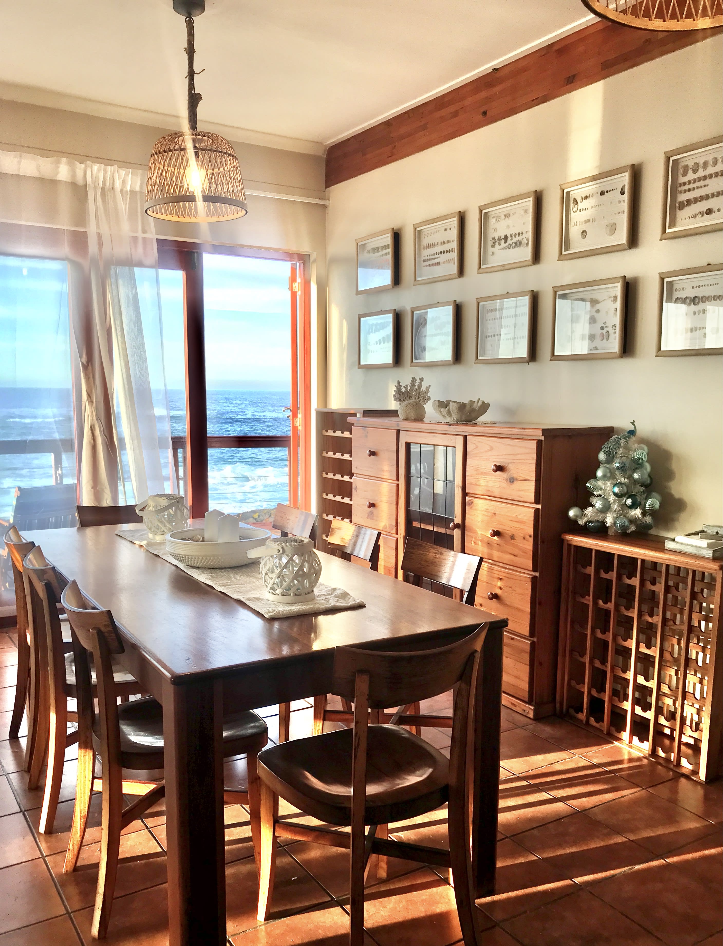 Curated book collection for guests in the living area at On The Rocks Villa