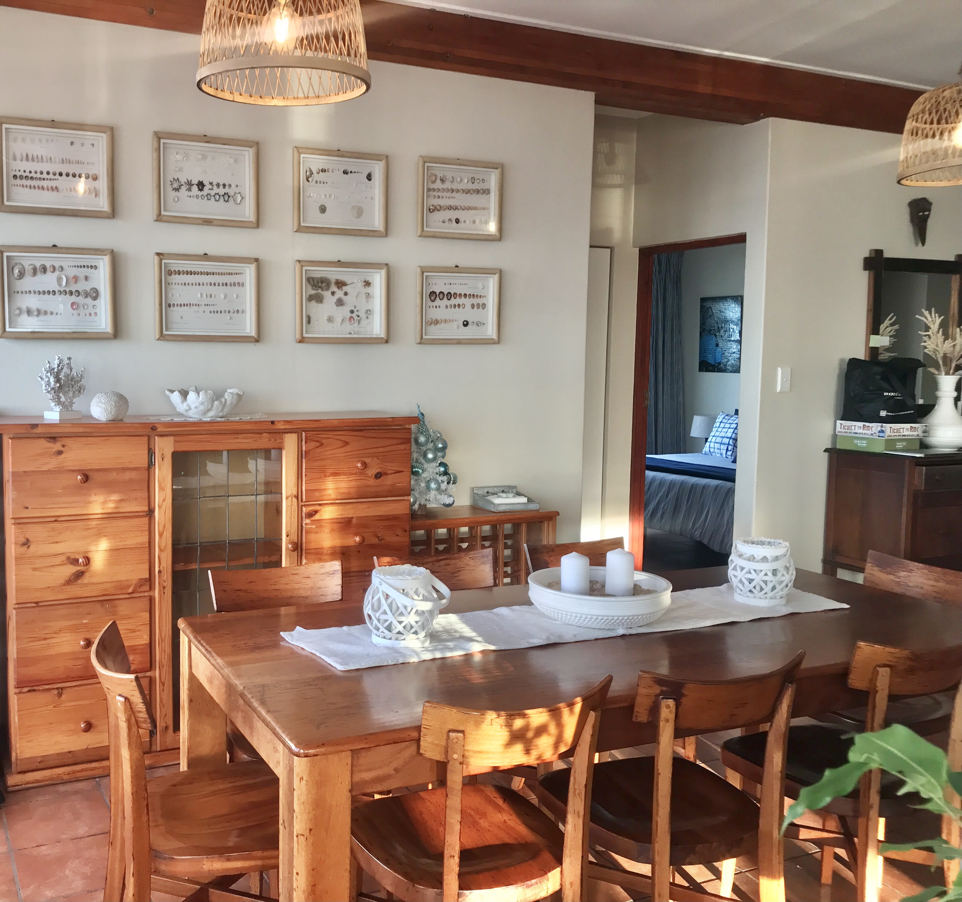 Central fireplace in the living and dining area at On The Rocks Villa
