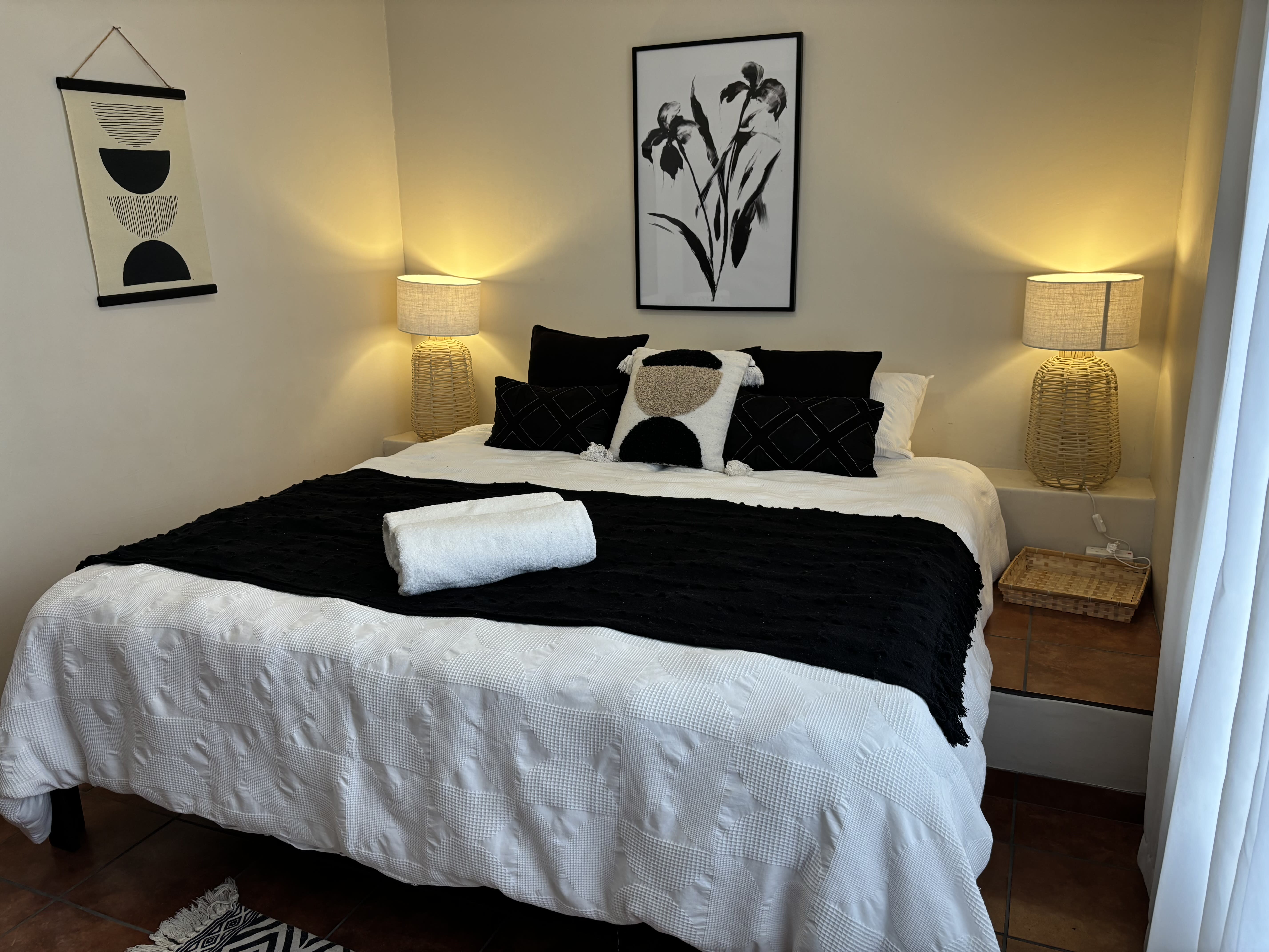 King bed in The Artist Room, artsy decor inspired by original artwork