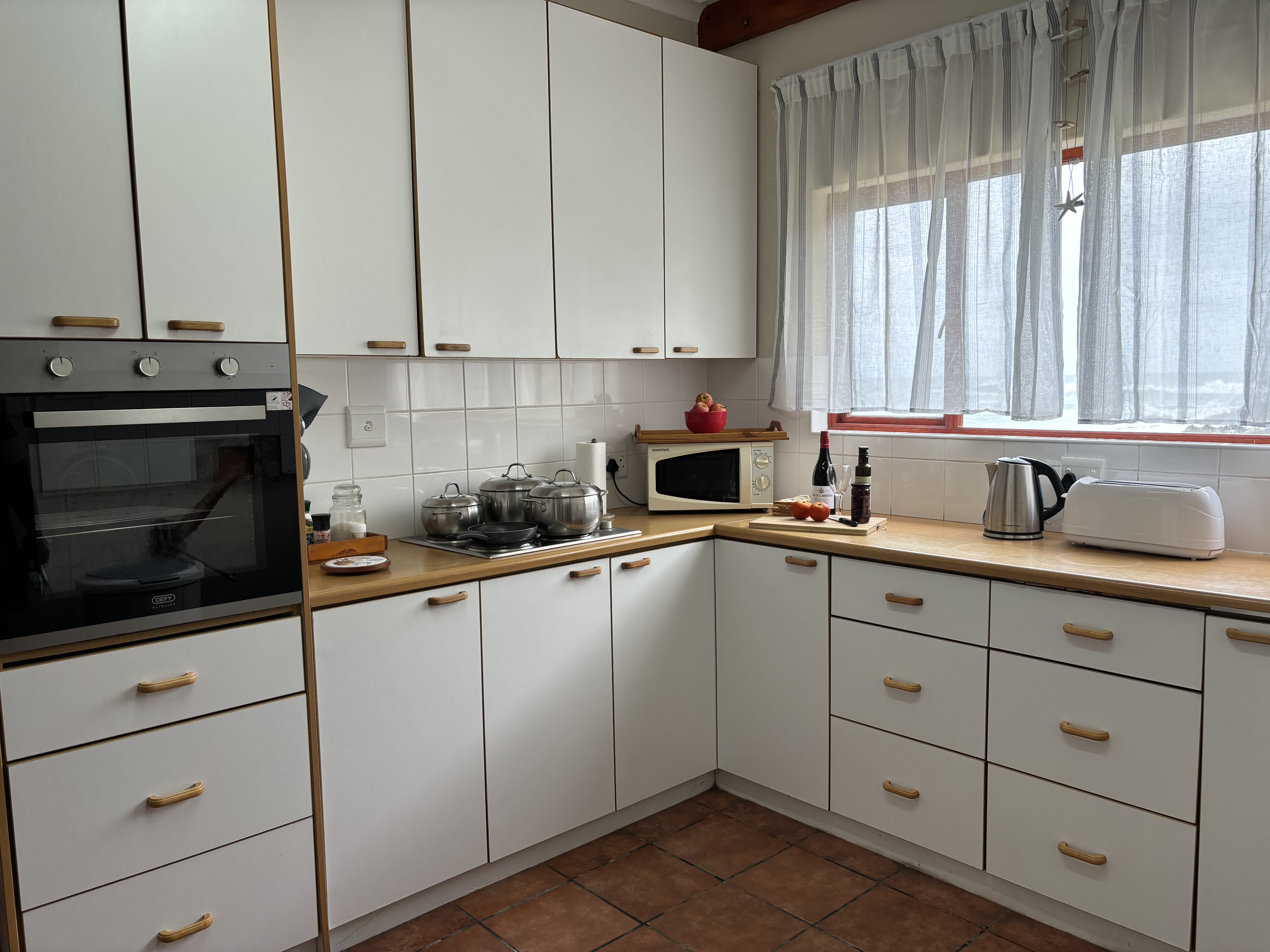 Evening ambiance in the living area at On The Rocks Villa beach house