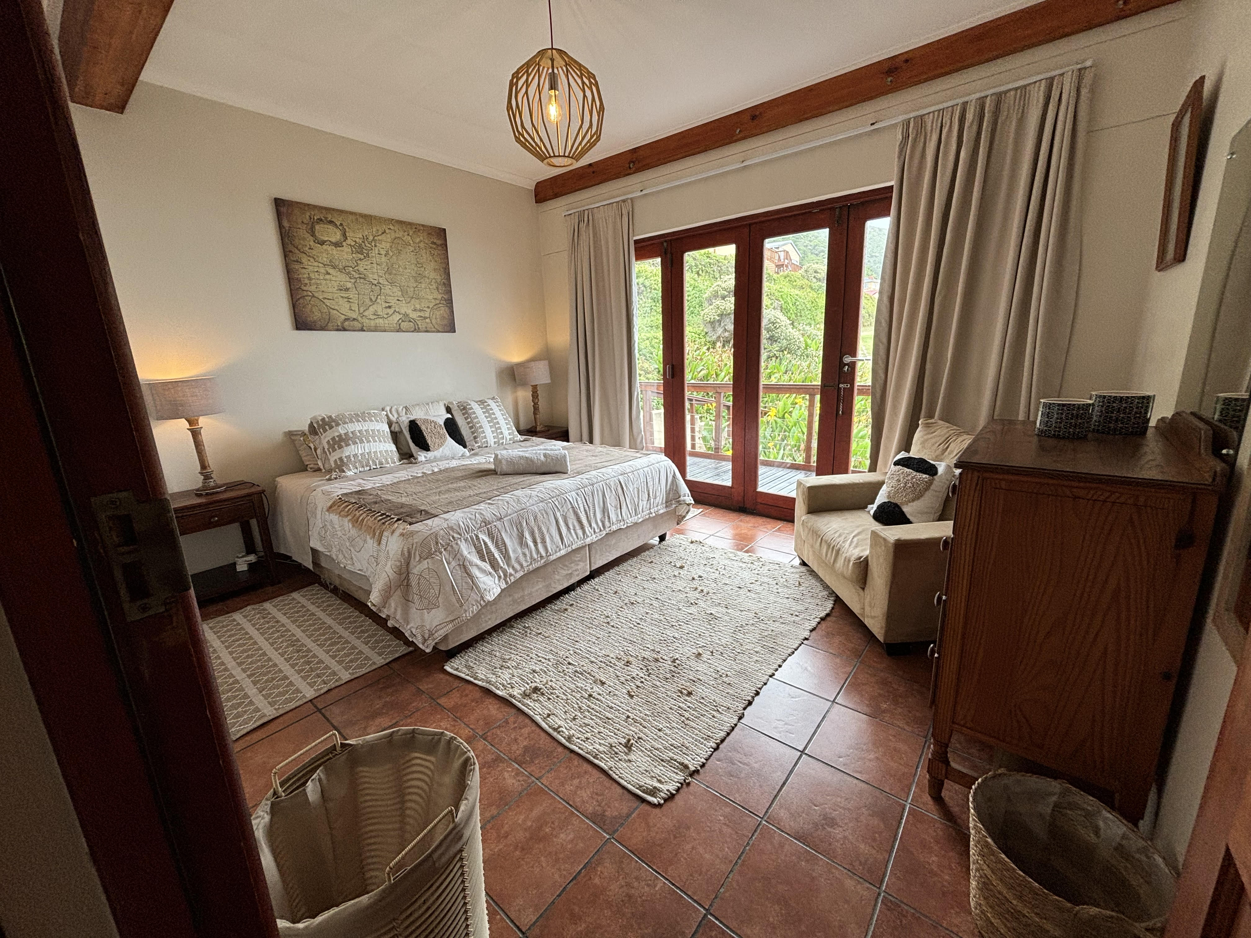 Super-king bed in The Sunrise Room at On The Rocks Villa, Eersterivierstrand