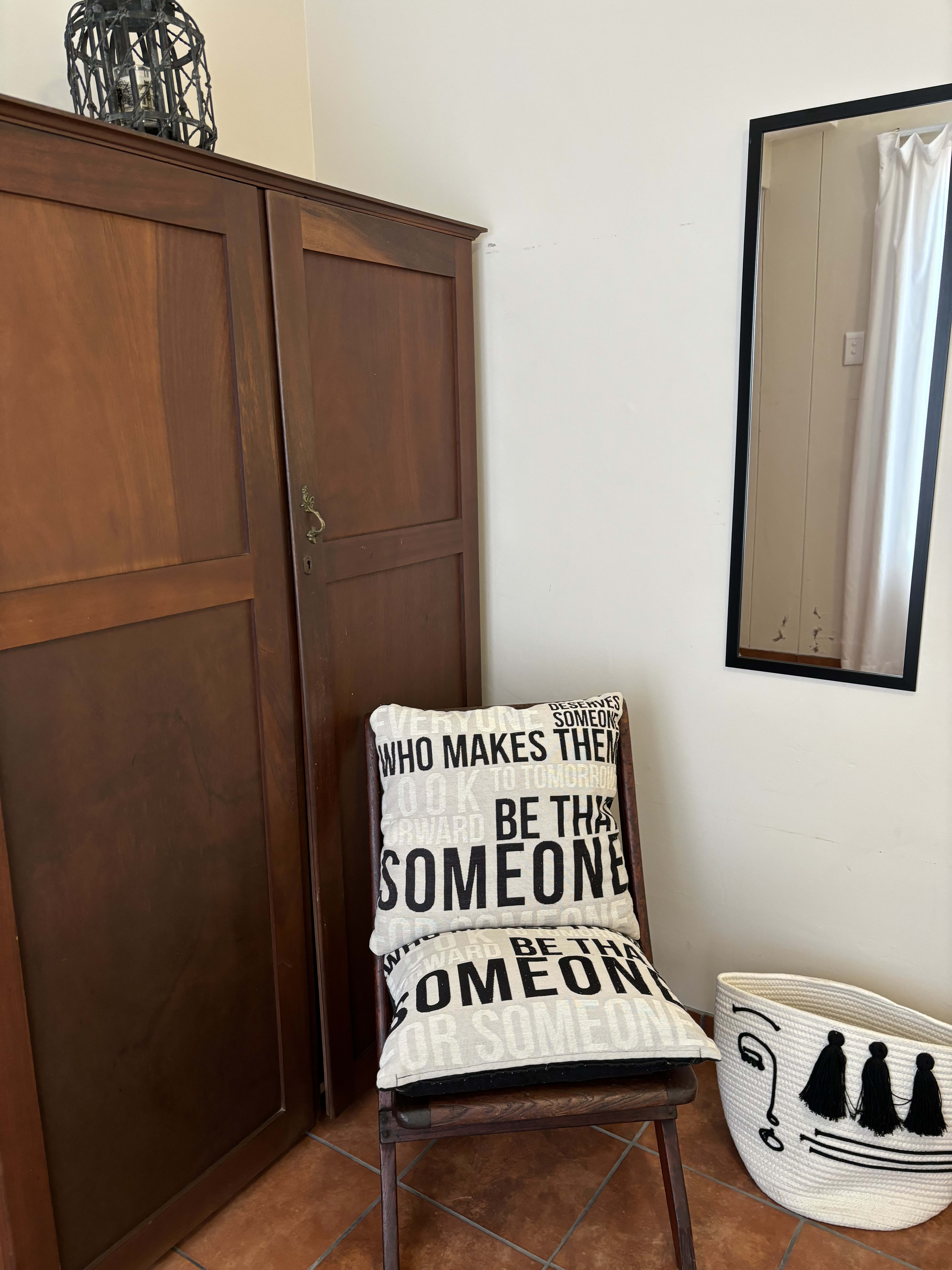 Original artwork and curated decor in The Artist Room beach house bedroom