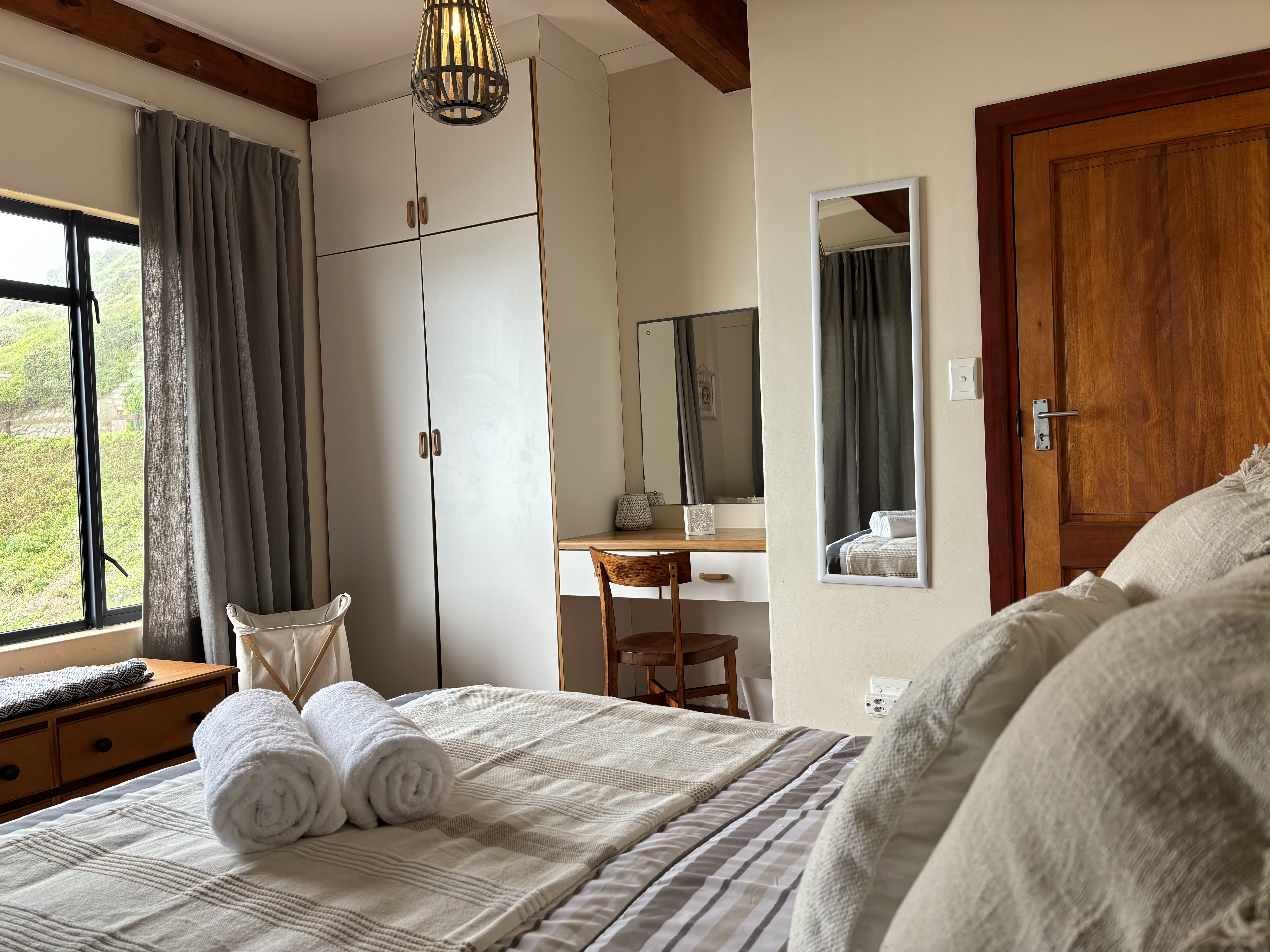 Double queen bed in the Ocean View Room at On The Rocks Villa