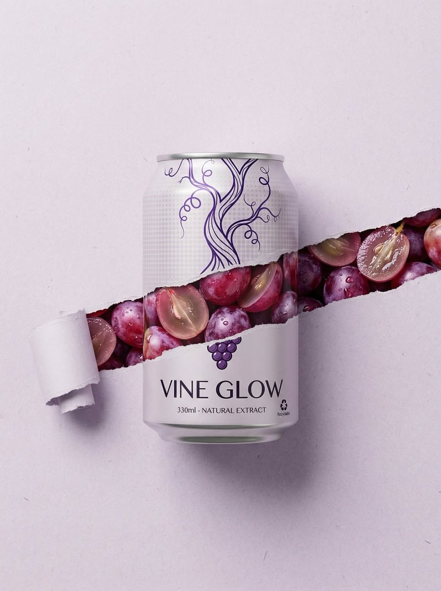 Minimalist grape beverage can labeled “Vine Glow†with a torn paper effect revealing fresh red and purple grapes inside under soft studio lighting.