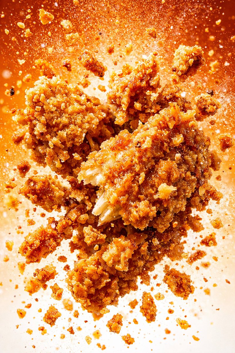 Hyper-realistic crispy fried chicken drumstick in cinematic liquid splash, mid-air floating reveal, and explosive fast-food commercial action scenes with dramatic lighting. Thumbnail 2