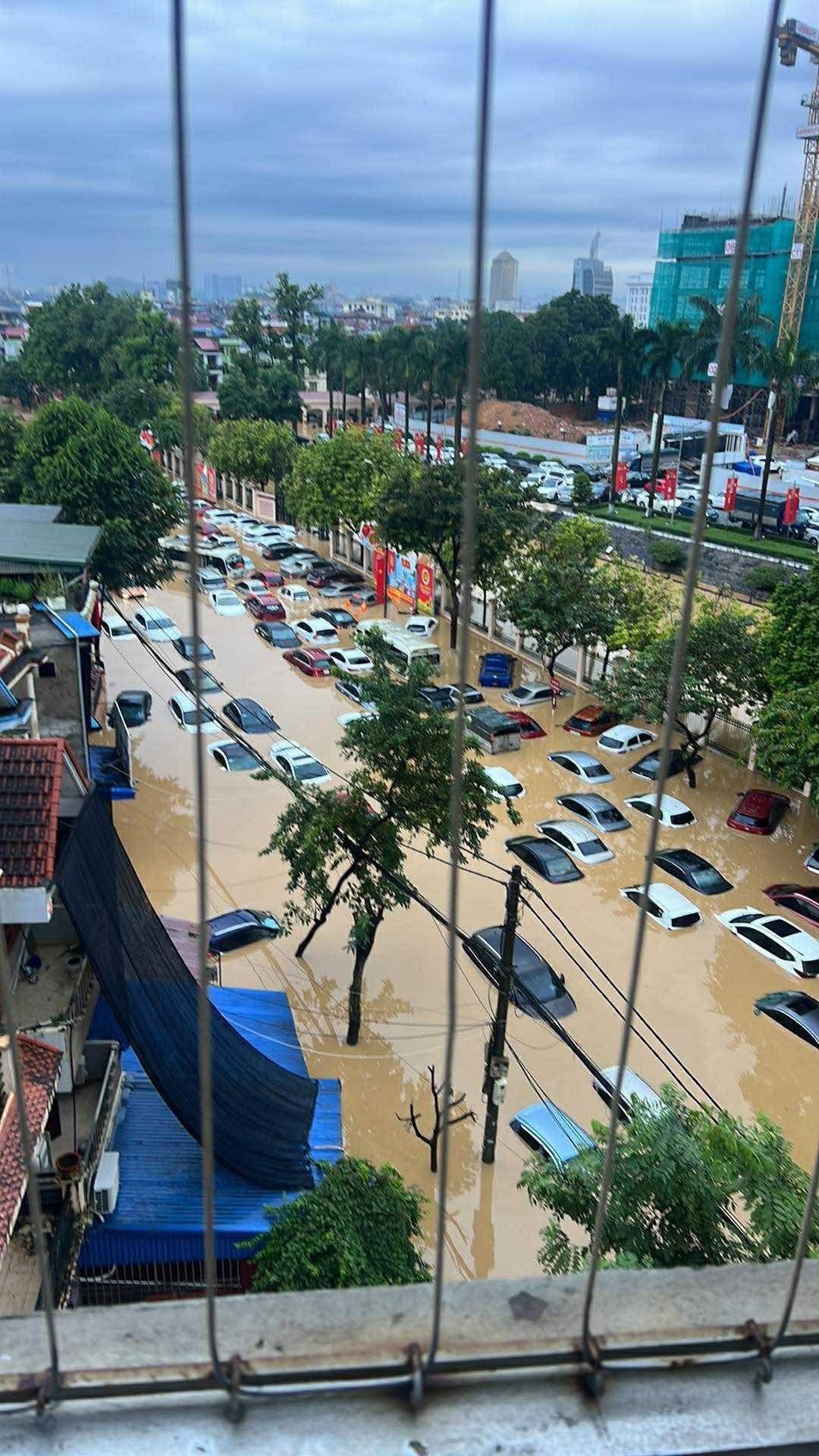 Aerial view of flooded parking areas in Thai Nguyen showing the massive scale of vehicle damage