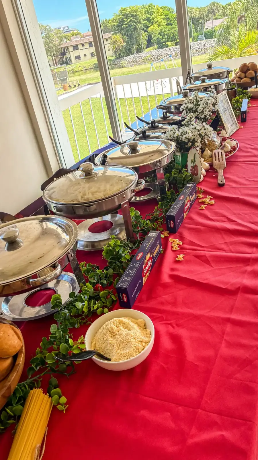 VNV Events live pasta station styled as a buffet with chafing pans and finishing toppings arranged for guests