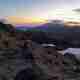 A panorama taken from midway up Snowdon before sunrise. The sky is lightening, but the landscape is still dark.