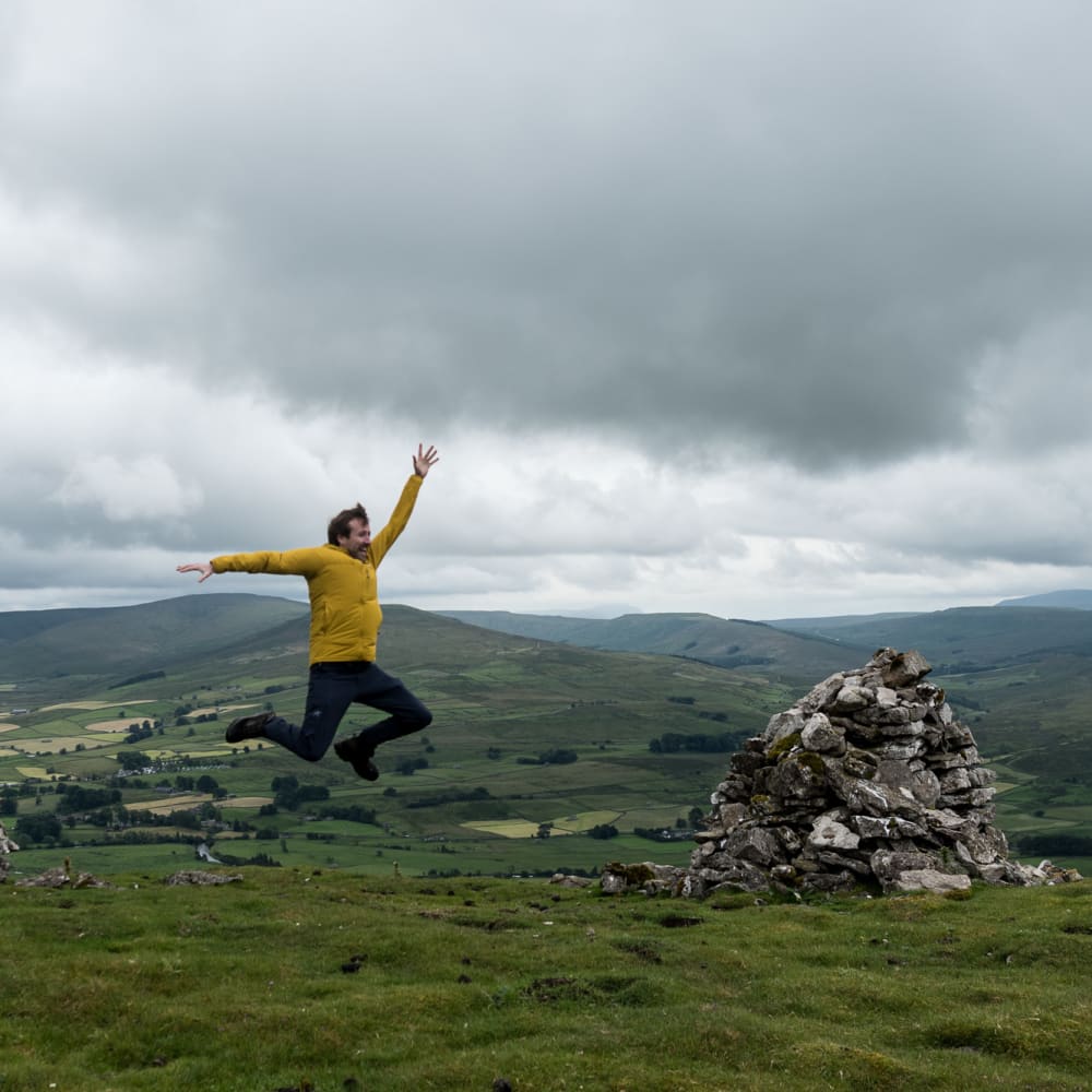 Ed jumping in mid-air. He’s facing sideways.