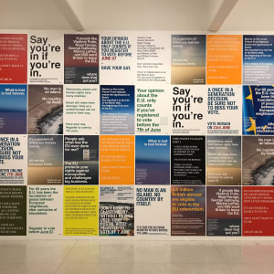A wall covered neatly with posters, 4 high and 11 across. The posters are mostly text based with some bold colours and show pro-EU, anti-brexit messages.