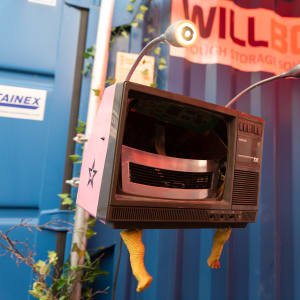 An empty plastic CRT case with two lights for eyes
