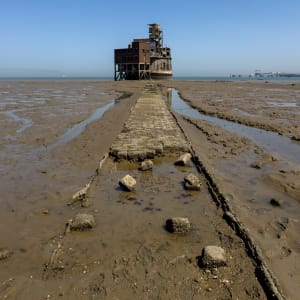 Exterior photo of the battery taken from afar, straight on pointing along the path to it.