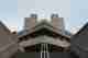 Looking up at one of the entrances to the National Theatre. The photo is symmetrical - the corner leads to a stairwell at 45º, and the camera is at the bottom of the stairs.