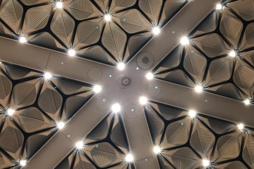 A detail shot of the celing lights in the Bloomberg building. There lights are small LEDs surrounded by curved plastic.
