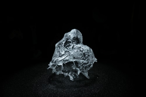 A round shower of water is frozen in mid air by strobe lighting.