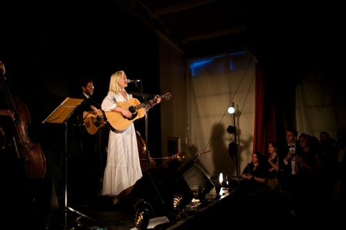Laura Marling sings whilst playing the guitar.