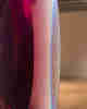 A closeup of a translucent dark red and violet object.