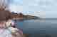 A photo from the shore of Lake Superior, looking East. There’s snowy frocks on the right.