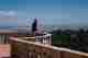 A photo of Ed Horsford looking out over a round balcony to the landscape of Sintra beyond