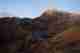 The jagged face of snowdon before sunrise. The mountain has a light dusting of snow on the top.