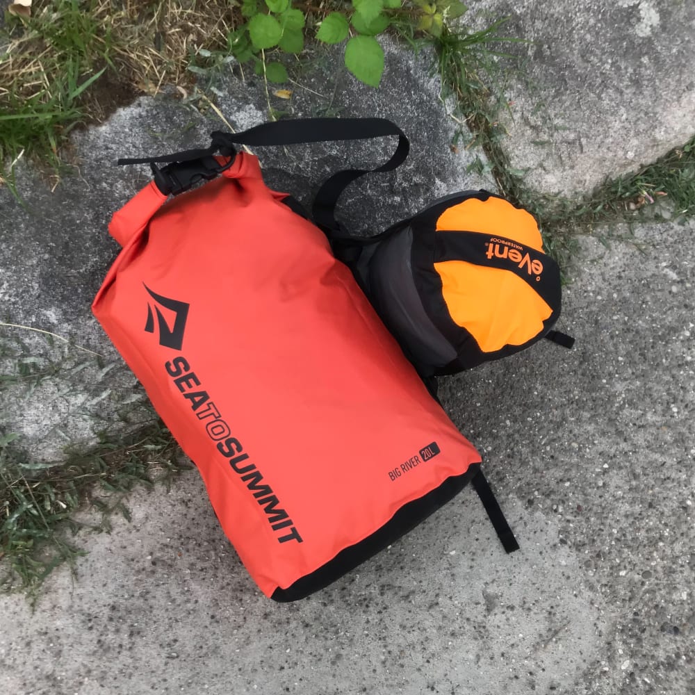 A photo of two dry bags on the floor.